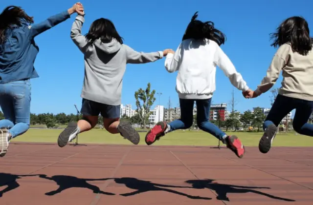 smiling jumping girls