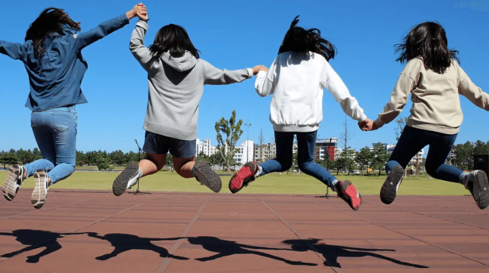 smiling jumping girls