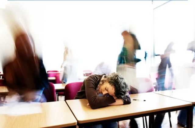 sleeping student at desk