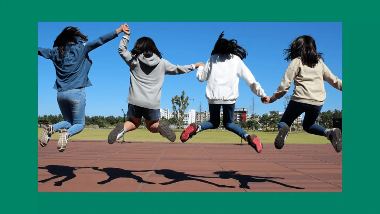 leaping school children in the air